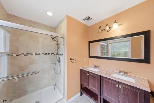 a kitchen with a sink and a refrigerator