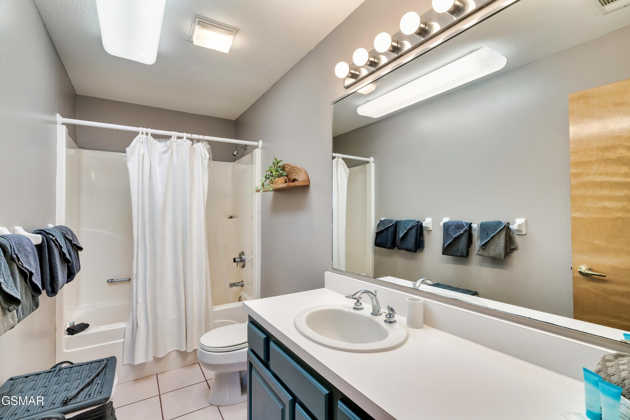 4062 Wilhite Road Sevierville, TN 37876 - Photo 29 of 50 a bathroom with a granite countertop sink and a mirror