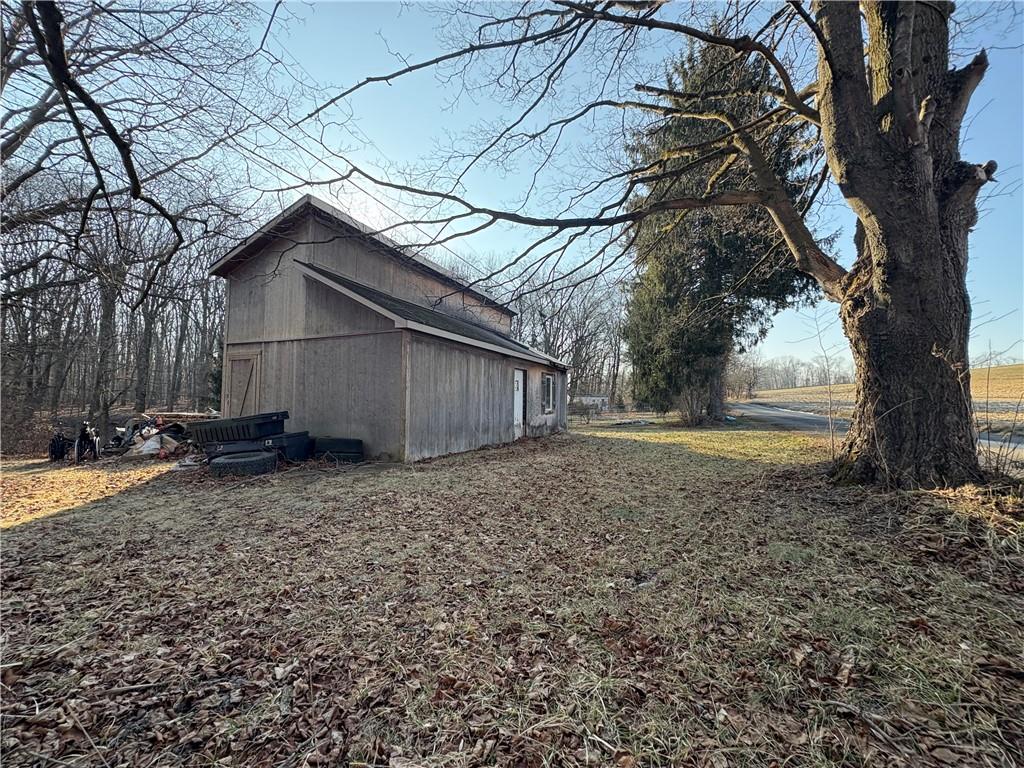 367 Studebaker Road Slippery Rock, PA 16057 - Photo 6 of 14 a view of a yard with wooden fence and a large tree