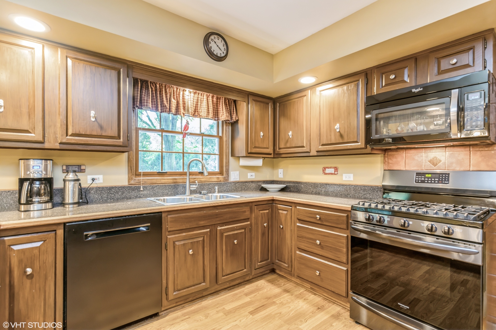 232 Aberdeen Road Cary, IL 60013 - Photo 5 of 22 a kitchen with a sink stove top oven and cabinets
