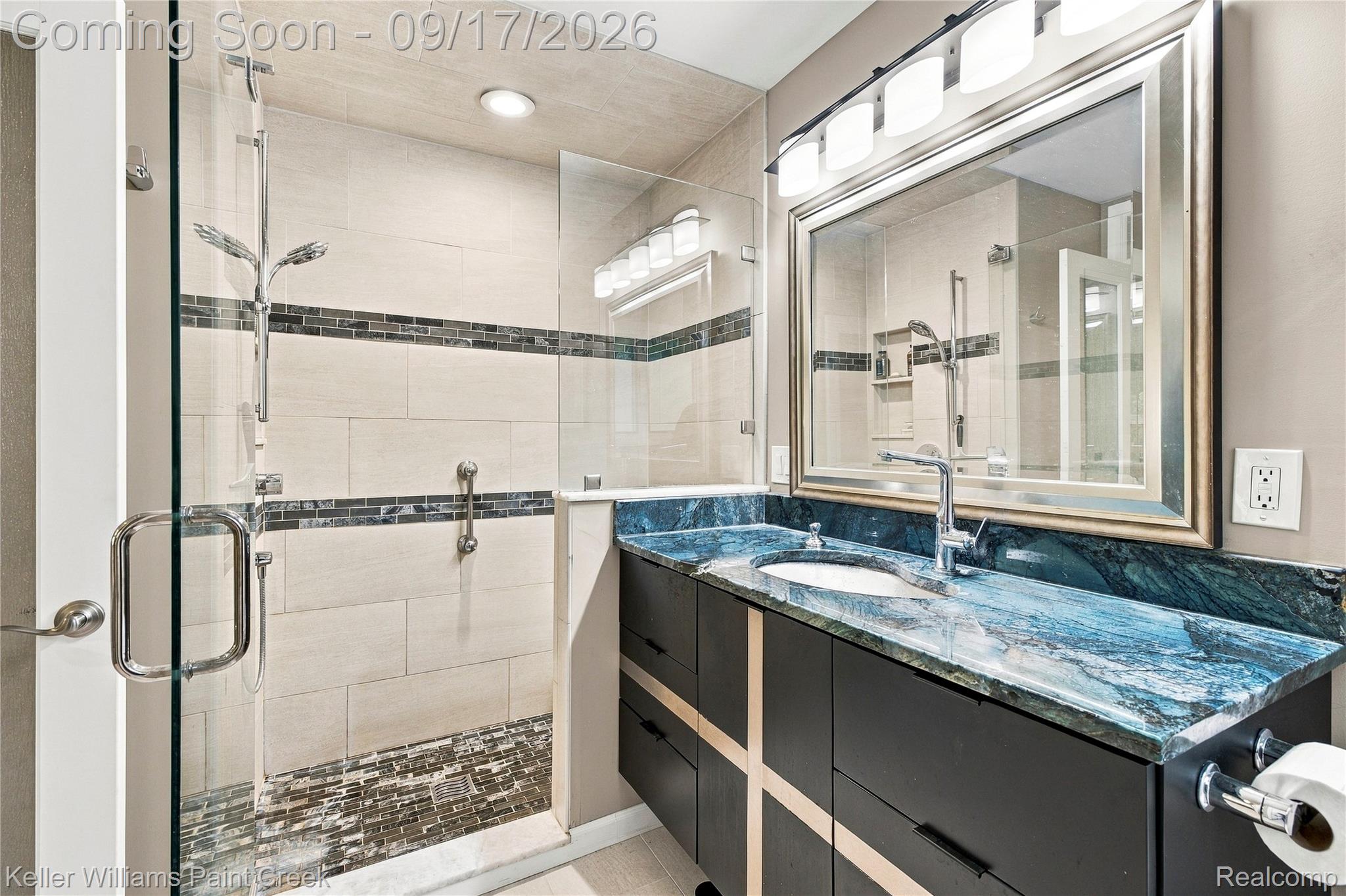 4535 Orion Road Rochester, MI 48306 - Photo 37 of 67 Walk-in shower with a glass enclosure, rectangular wall tiles, and mosaic floor