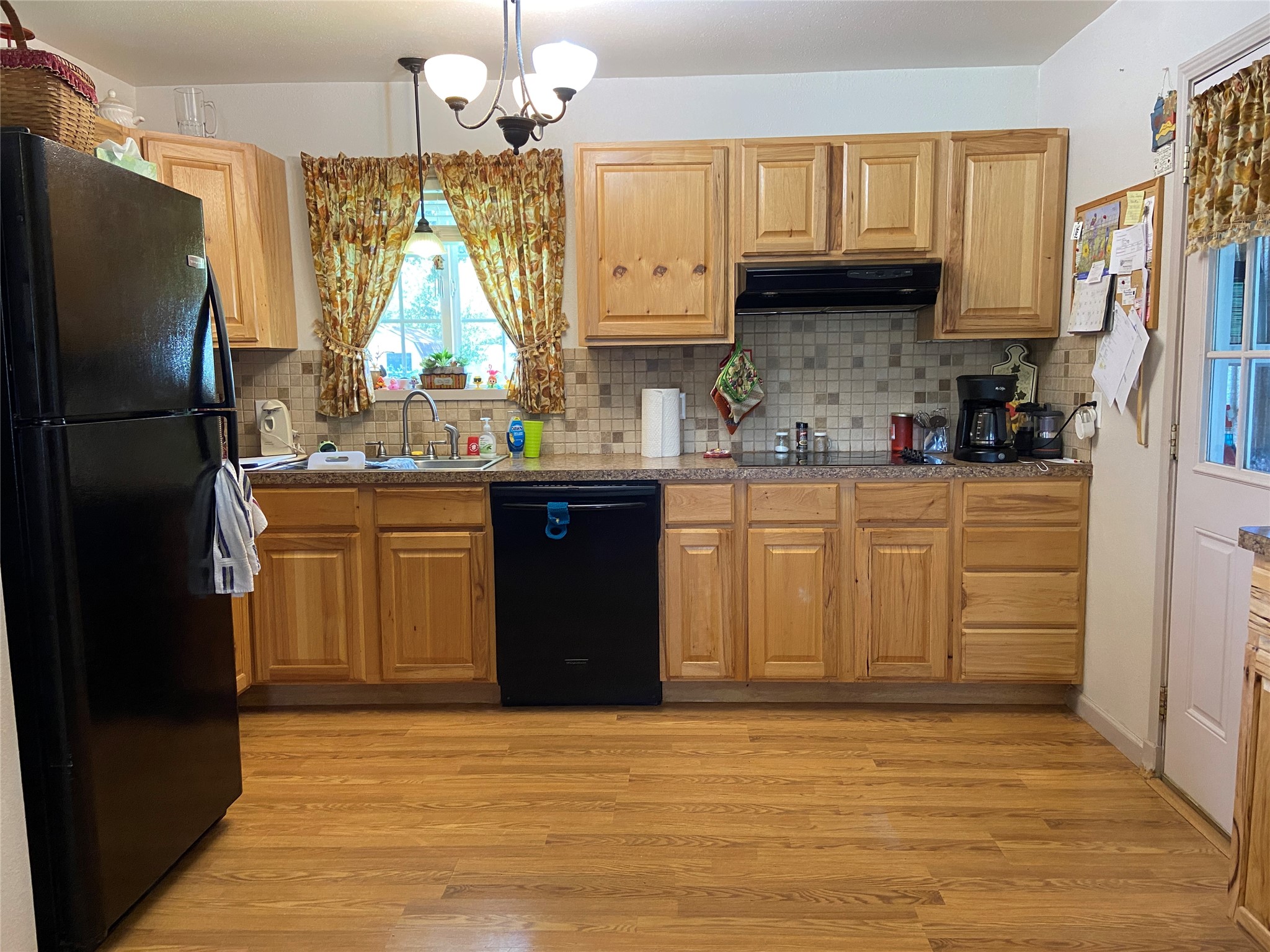 181 Hawk Livingston, TX 77399 - Photo 11 of 26 a kitchen with stainless steel appliances granite countertop a refrigerator a sink dishwasher a stove top oven a refrigerator and cabinets