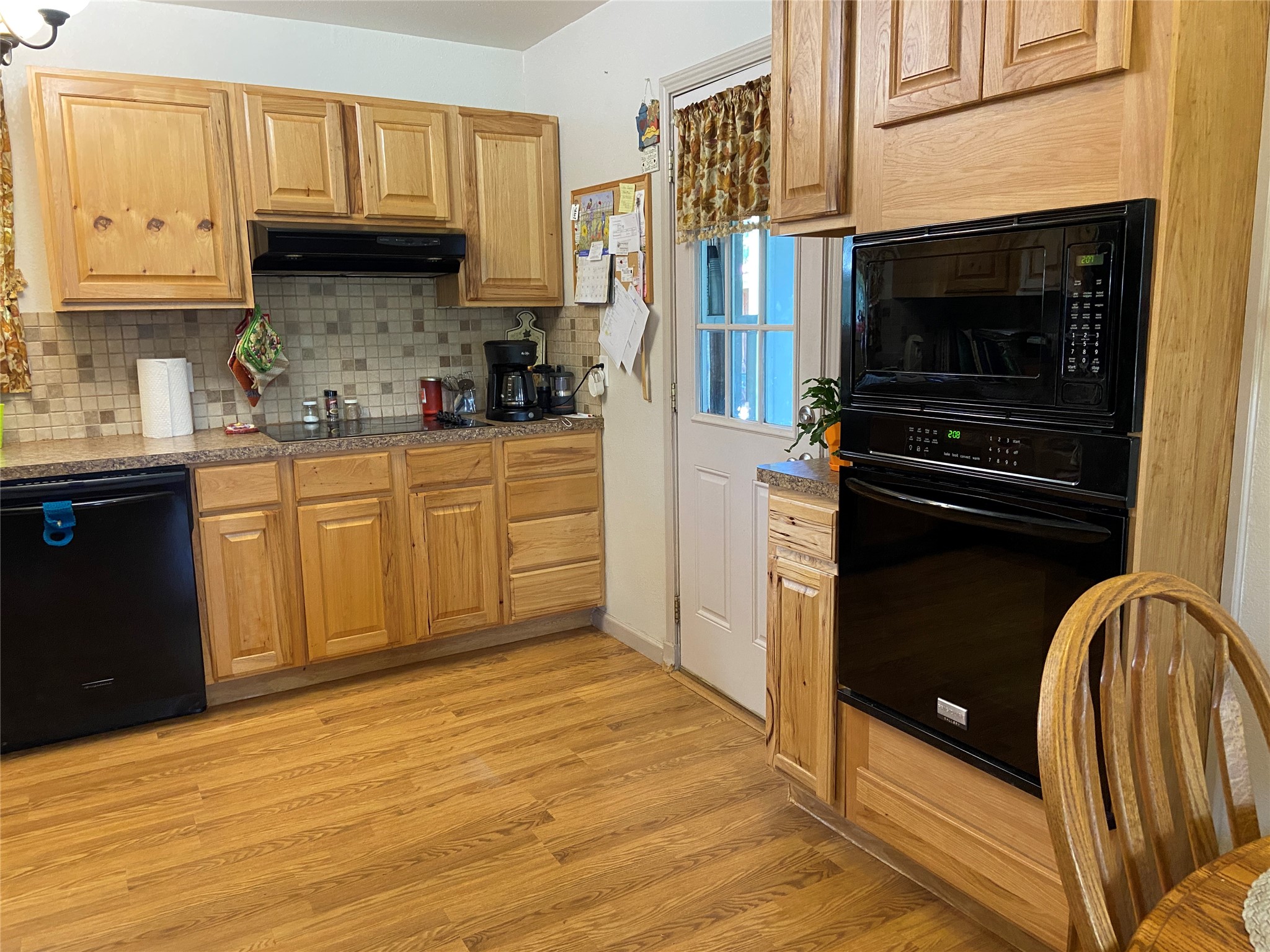 181 Hawk Livingston, TX 77399 - Photo 13 of 26 a kitchen with stainless steel appliances granite countertop a stove a sink and a refrigerator