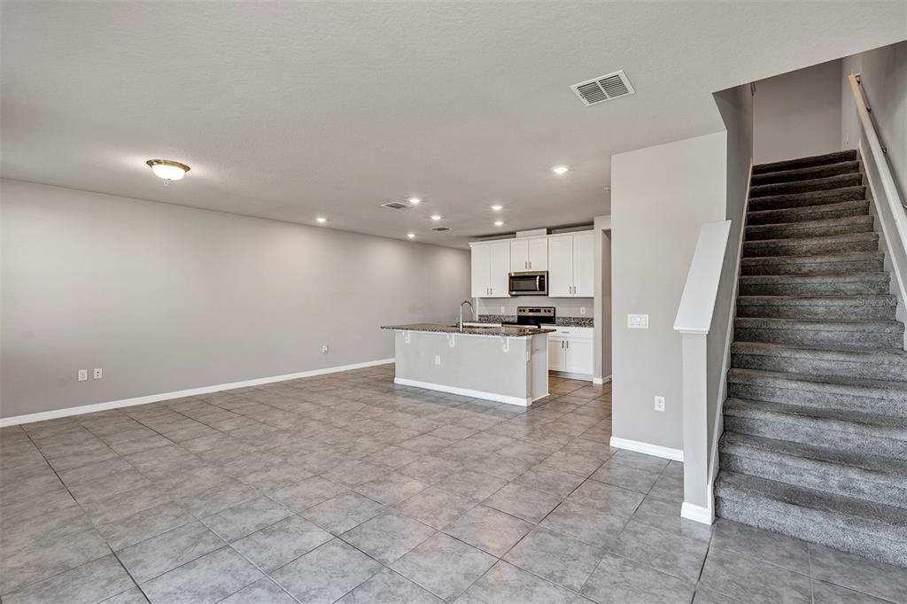 1073 Desert Candle Drive Ocoee, FL 34761 - Photo 13 of 55 a view of kitchen with cabinets and refrigerator