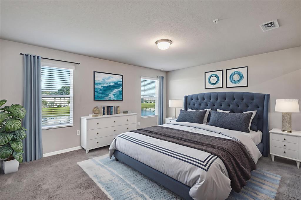 1073 Desert Candle Drive Ocoee, FL 34761 - Photo 14 of 55 a bedroom with a large bed and a window