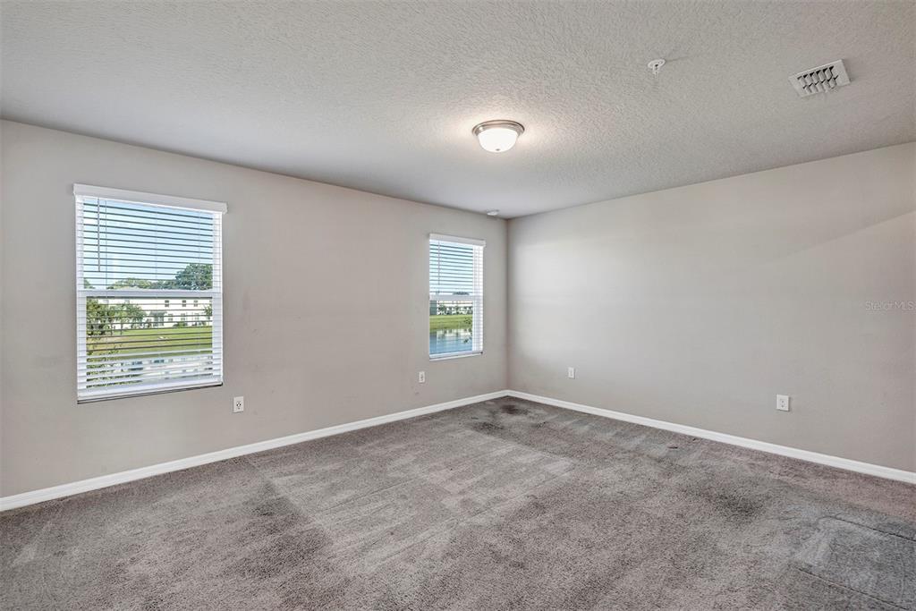1073 Desert Candle Drive Ocoee, FL 34761 - Photo 16 of 55 a view of an empty room with a window