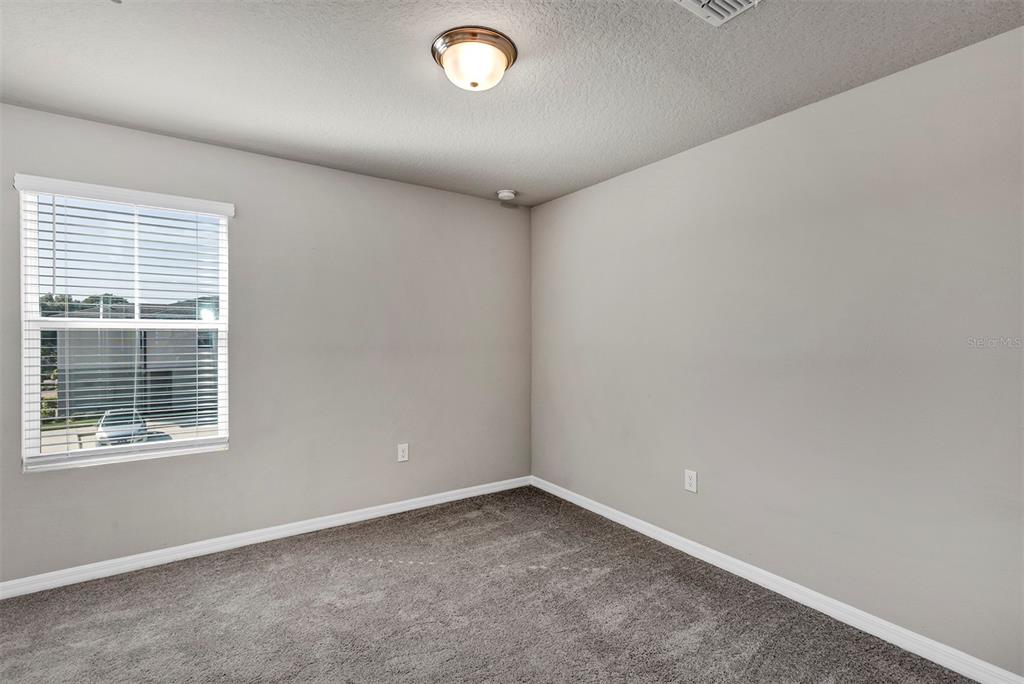 1073 Desert Candle Drive Ocoee, FL 34761 - Photo 17 of 55 an empty room with a window