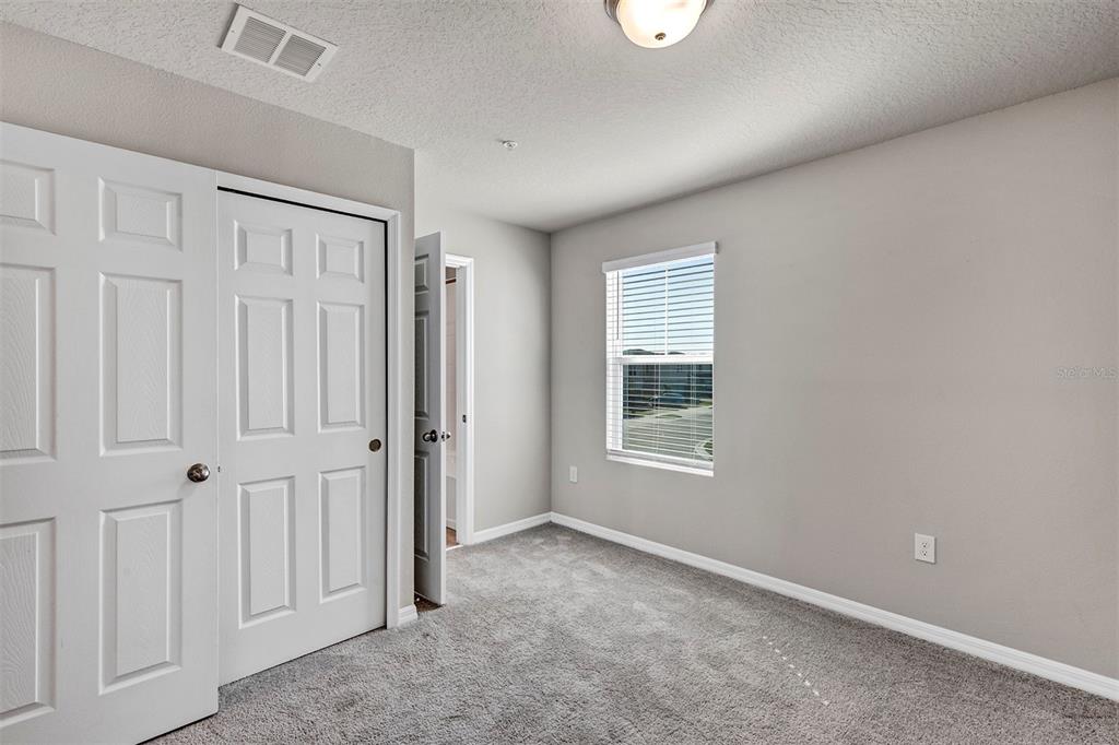 1073 Desert Candle Drive Ocoee, FL 34761 - Photo 18 of 55 an empty room with windows