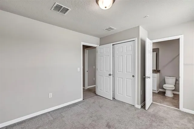 an empty room with a empty space and windows