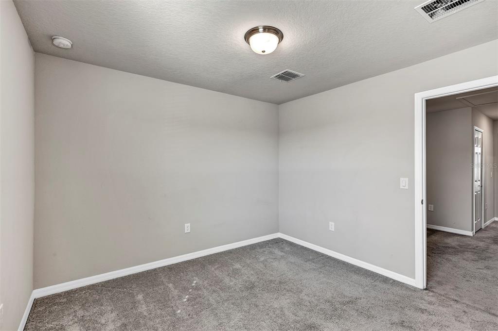 1073 Desert Candle Drive Ocoee, FL 34761 - Photo 20 of 55 an empty room with a empty space and windows