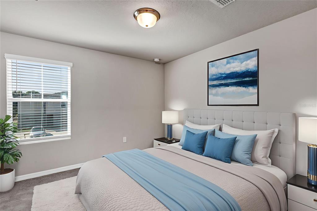 1073 Desert Candle Drive Ocoee, FL 34761 - Photo 24 of 55 a bedroom with bed and a window