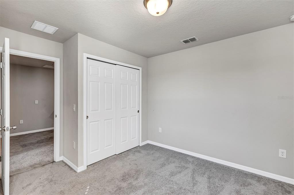 1073 Desert Candle Drive Ocoee, FL 34761 - Photo 26 of 55 an empty room with closet