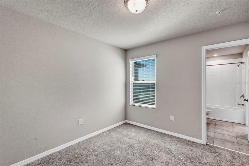 1073 Desert Candle Drive Ocoee, FL 34761 - Photo 27 of 55 an empty room with windows and closet