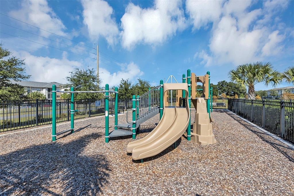 1073 Desert Candle Drive Ocoee, FL 34761 - Photo 37 of 55 a view of a park with swings