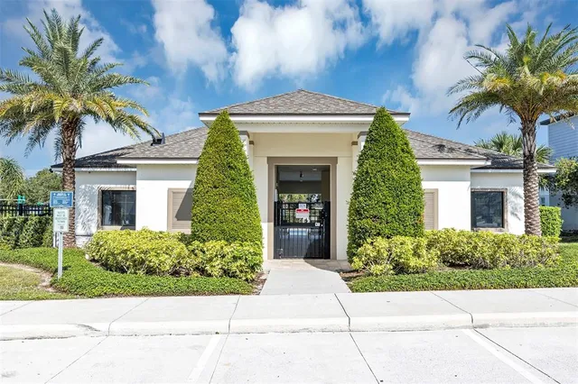 a view of a swimming pool and lounge chairs