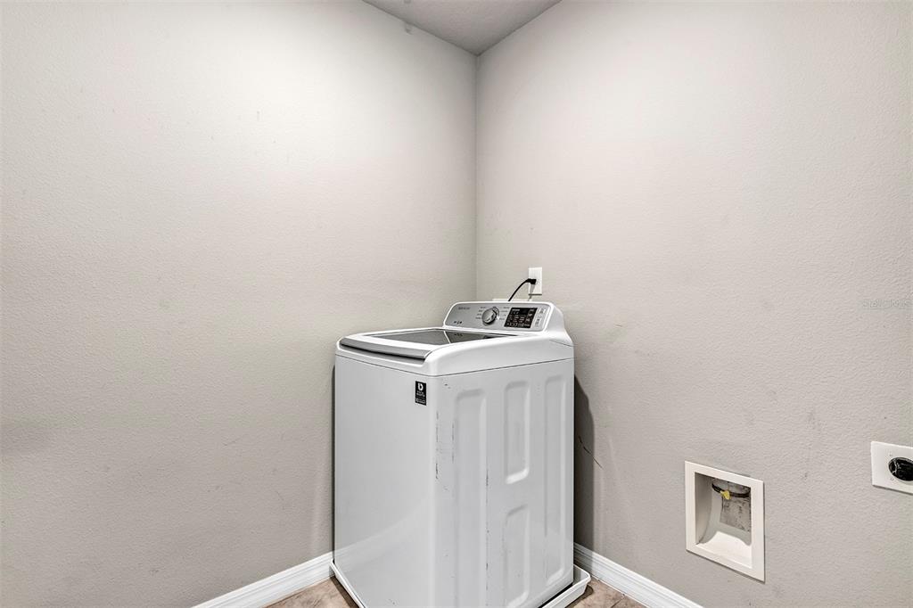 1073 Desert Candle Drive Ocoee, FL 34761 - Photo 53 of 55 a utility room with dryer and washer