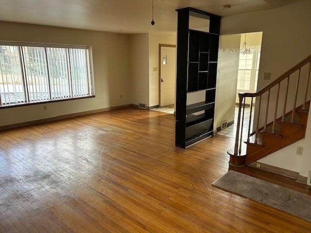2122 Highway 130 Pleasant Unity, PA 15676 - Photo 7 of 16 an empty room with wooden floor and windows