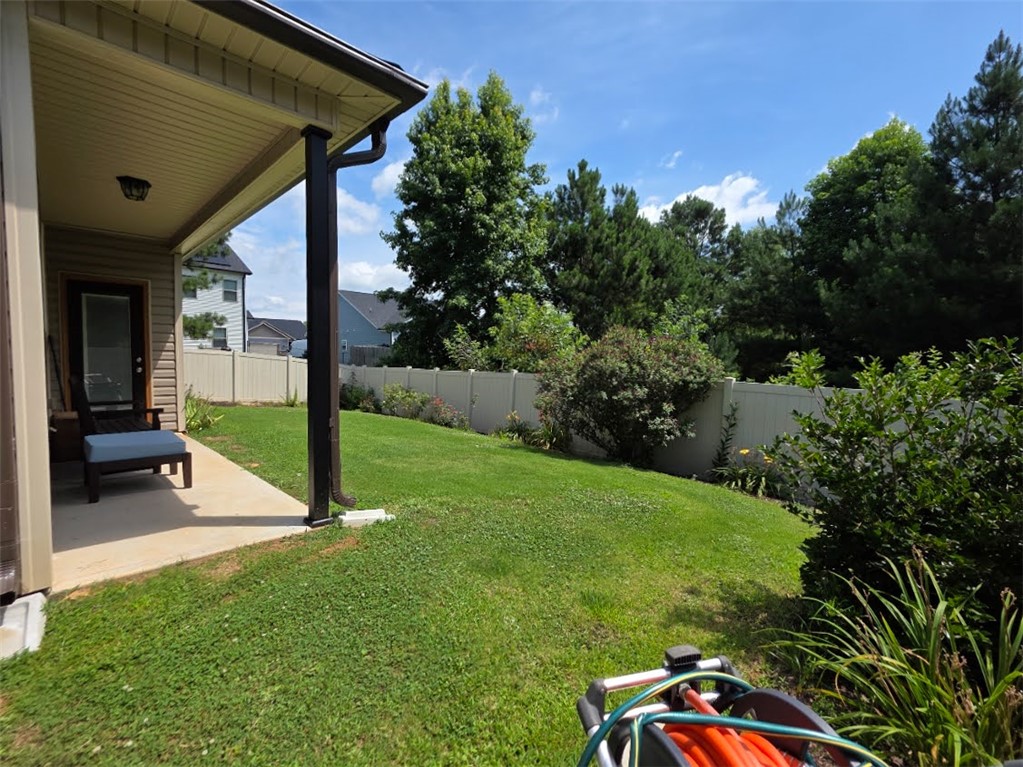 3 Cringle Lane Anderson, SC 29625 - Photo 16 of 26 A private backyard oasis with a covered patio offers seamless indoor-outdoor living.