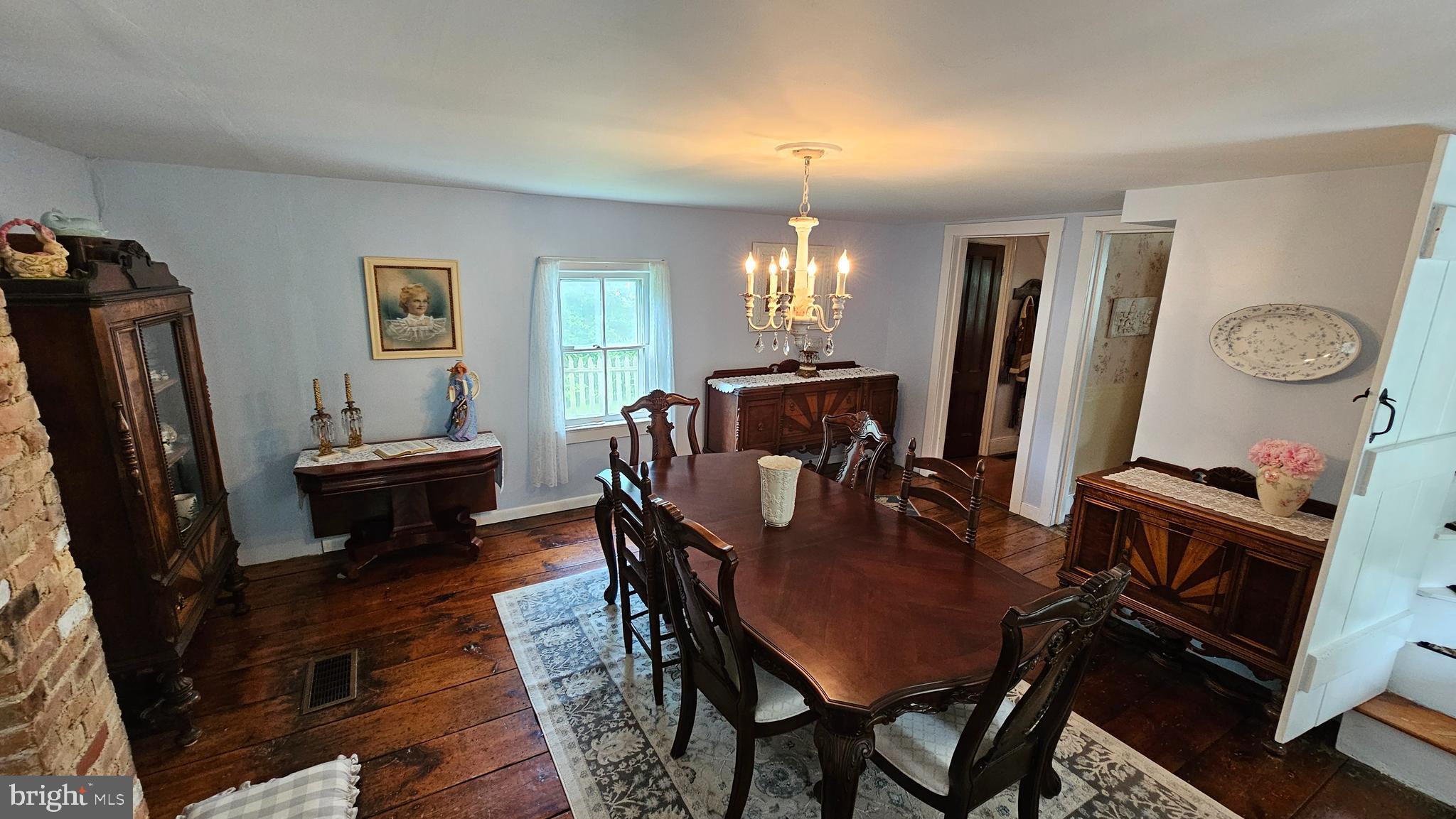 441 Dutch Neck Road East Windsor, NJ 08520 - Photo 19 of 51 a view of a dining room with furniture and a chandelier