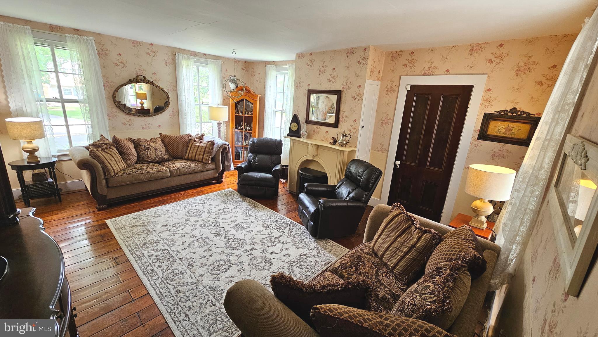 441 Dutch Neck Road East Windsor, NJ 08520 - Photo 7 of 51 a living room with furniture and a flat screen tv