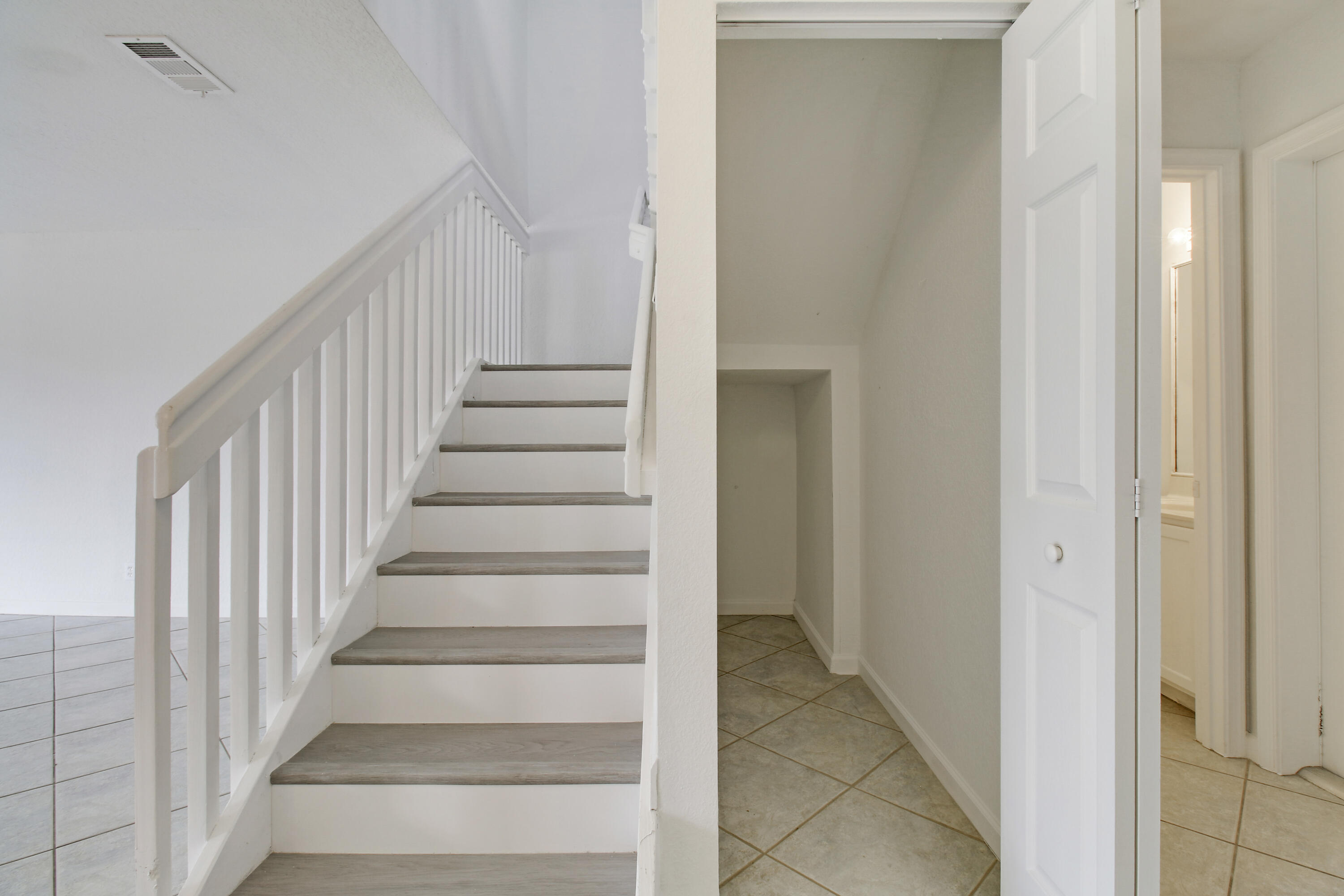 5505 Crossing Rocks Court, Unit 5505 Riviera Beach, FL 33407 - Photo 11 of 27 a view of a hallway with wooden floor and entryway