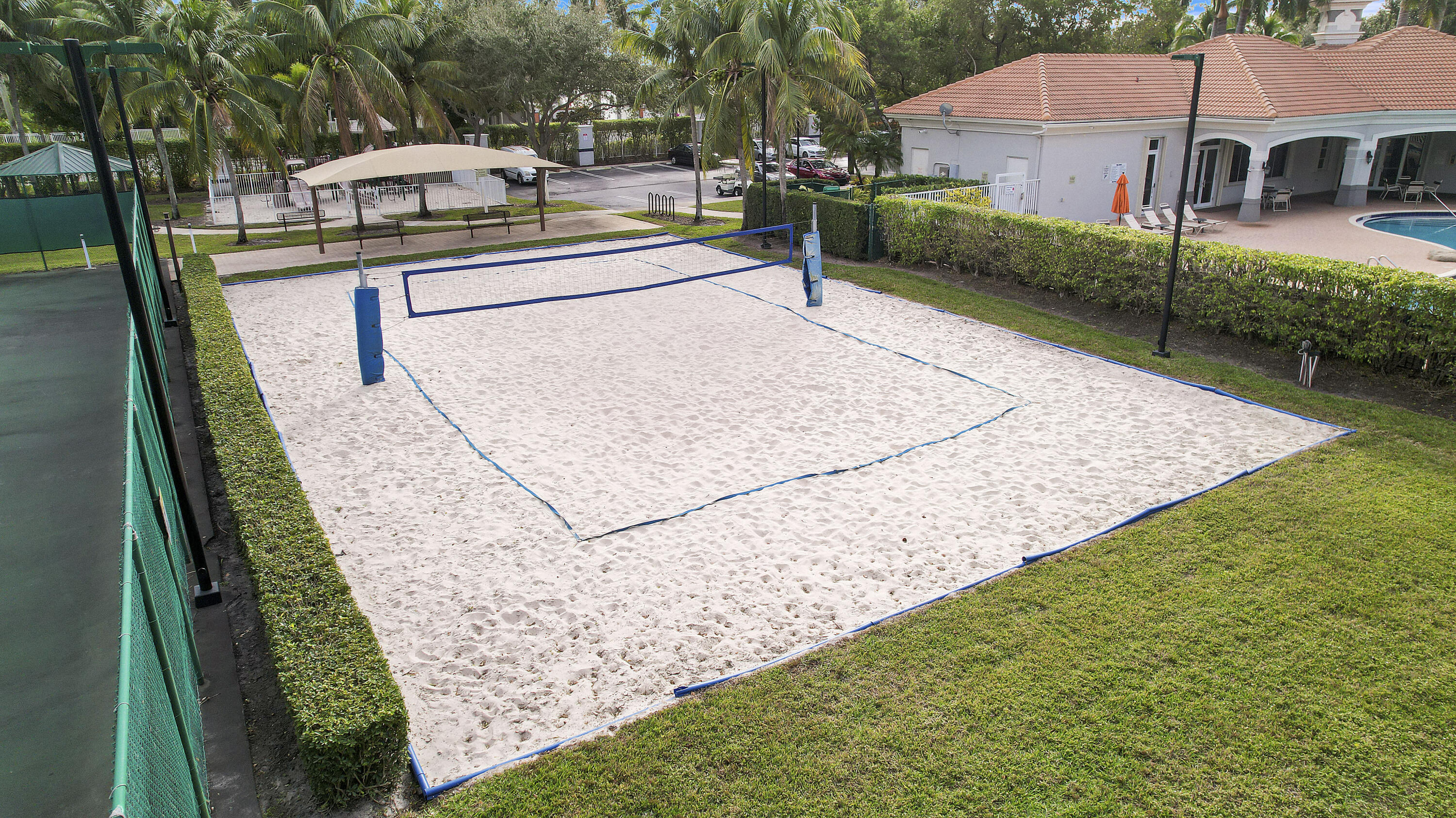 5505 Crossing Rocks Court, Unit 5505 Riviera Beach, FL 33407 - Photo 25 of 27 a swimming pool with barbeque oven outdoor seating and yard