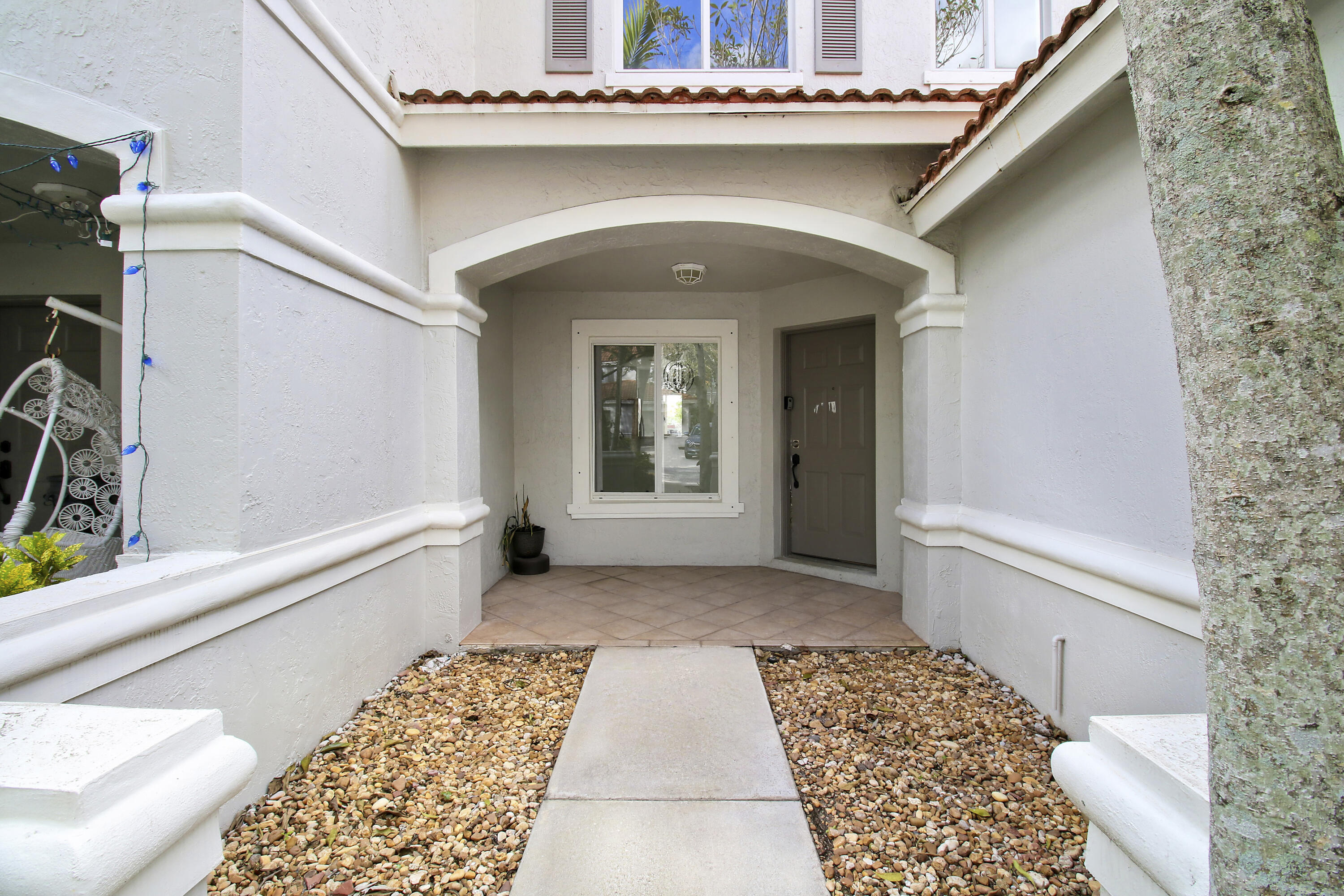 5505 Crossing Rocks Court, Unit 5505 Riviera Beach, FL 33407 - Photo 3 of 27 a view of a entryway door of the house