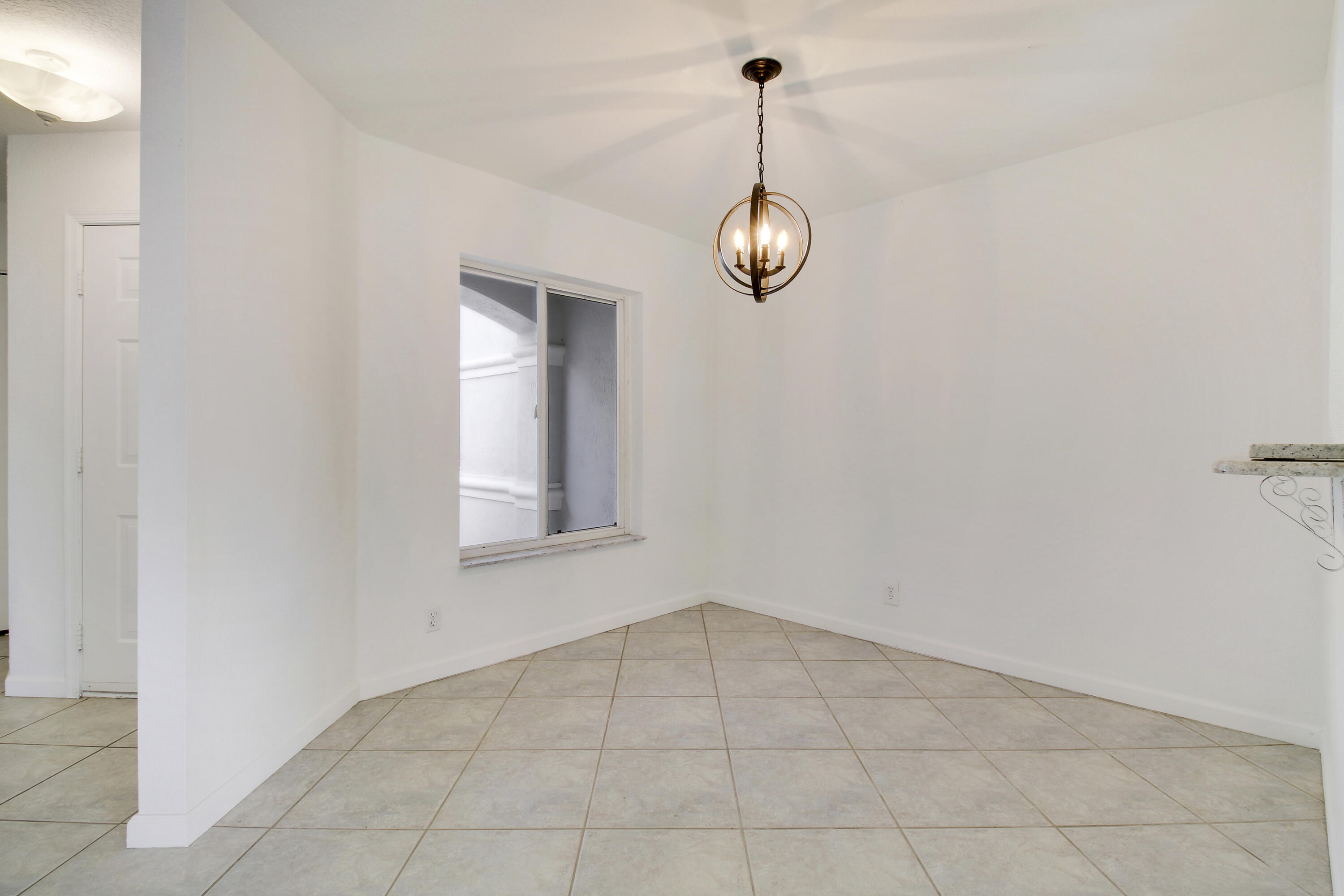 5505 Crossing Rocks Court, Unit 5505 Riviera Beach, FL 33407 - Photo 8 of 27 a view of an empty room with a window