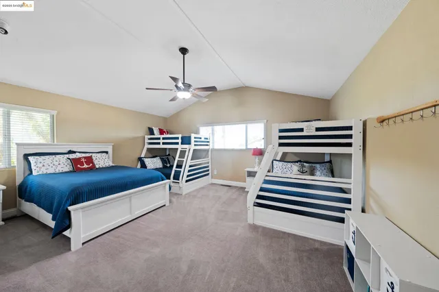 a balcony with wooden floor and lake view