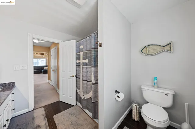 a bedroom with furniture and a ceiling fan