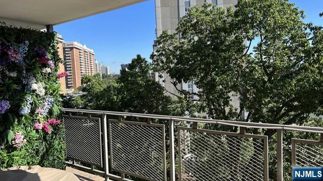 301 Beech Street, Unit 8D Hackensack, NJ 07601 - Photo 12 of 15 a balcony with a garden view