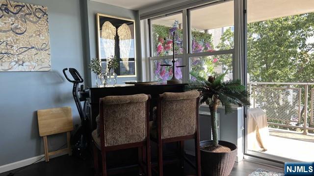 301 Beech Street, Unit 8D Hackensack, NJ 07601 - Photo 4 of 15 a dining room with furniture and window