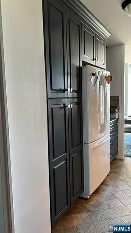 a view of a refrigerator in kitchen and a refrigerator