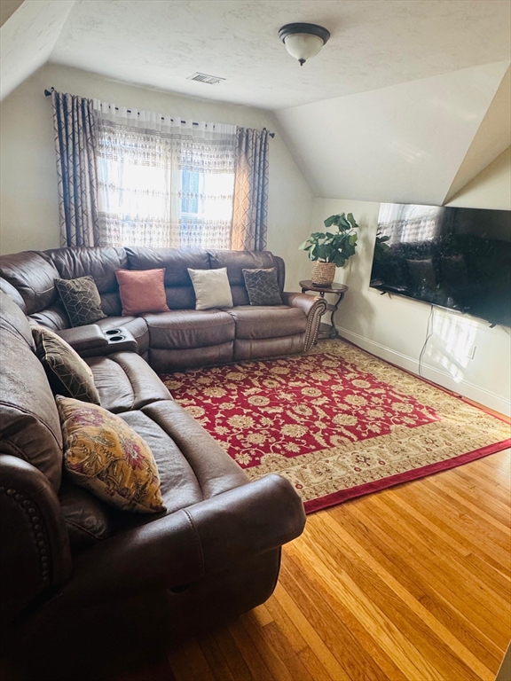 25 John Street, Unit 3 Attleboro, MA 02703 - Photo 2 of 10 a living room with furniture and a couch
