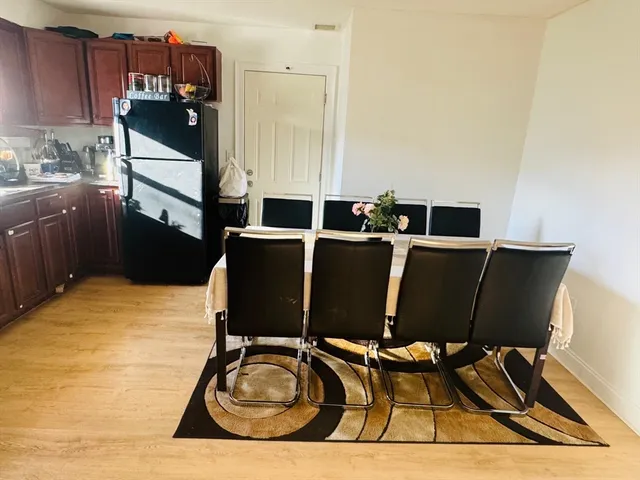 a kitchen with a table and chairs