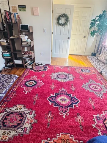 a view of a bedroom with a bed