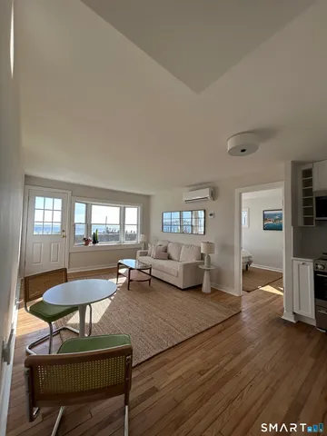 a living room with furniture and a table