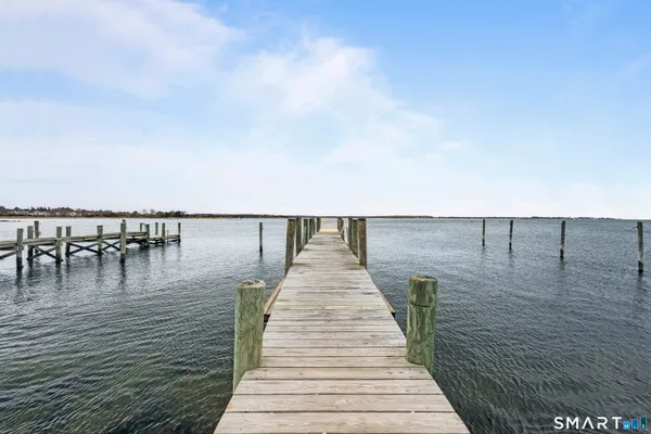 a view of wooden floor with a lake view