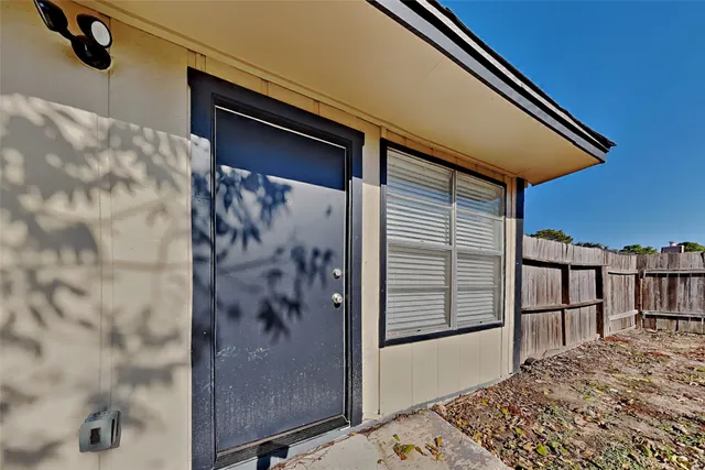 a bathroom with a shower and a sink
