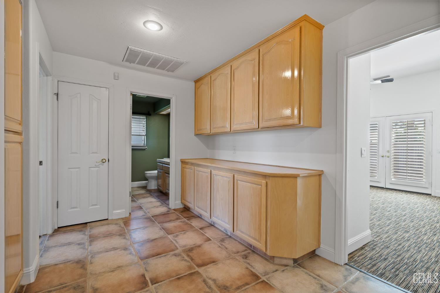 Undisclosed Address Bakersfield, CA 93308 - Photo 16 of 30 a view of a hallway with wooden floor and cabinet