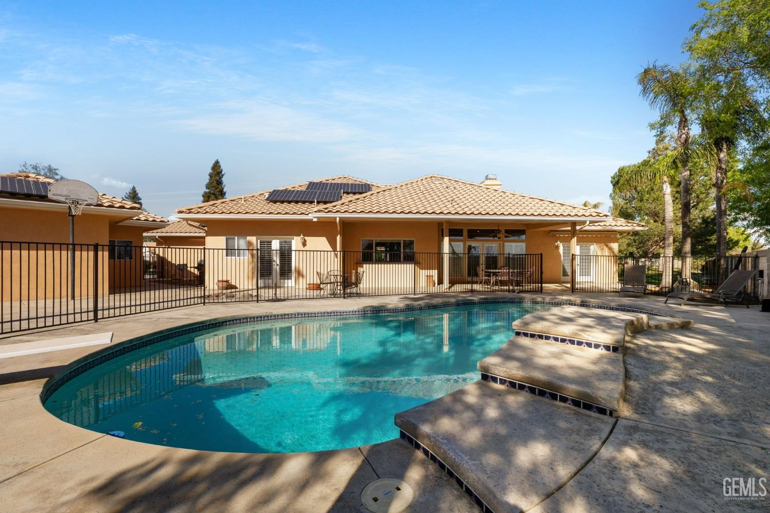 Undisclosed Address Bakersfield, CA 93308 - Photo 20 of 30 a swimming pool view with a seating space