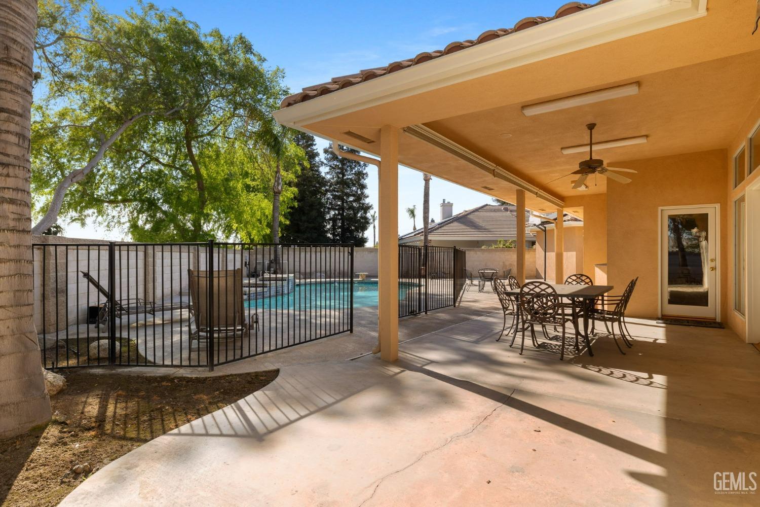 Undisclosed Address Bakersfield, CA 93308 - Photo 21 of 30 a view of a patio with a table and chairs