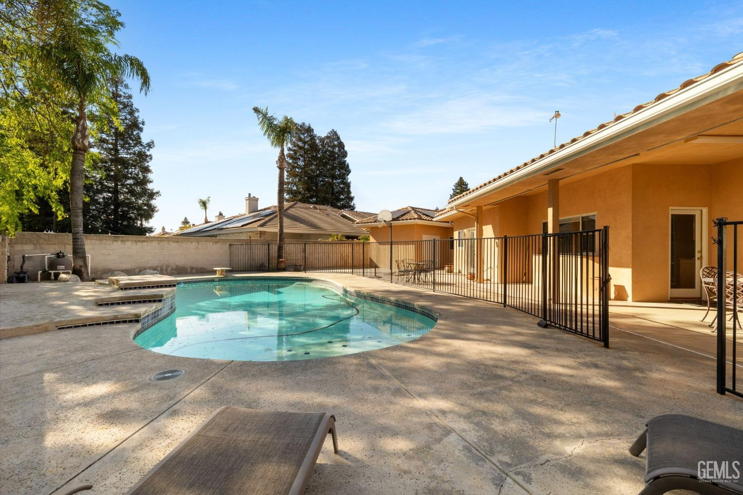 Undisclosed Address Bakersfield, CA 93308 - Photo 25 of 30 a view of a white house with a yard