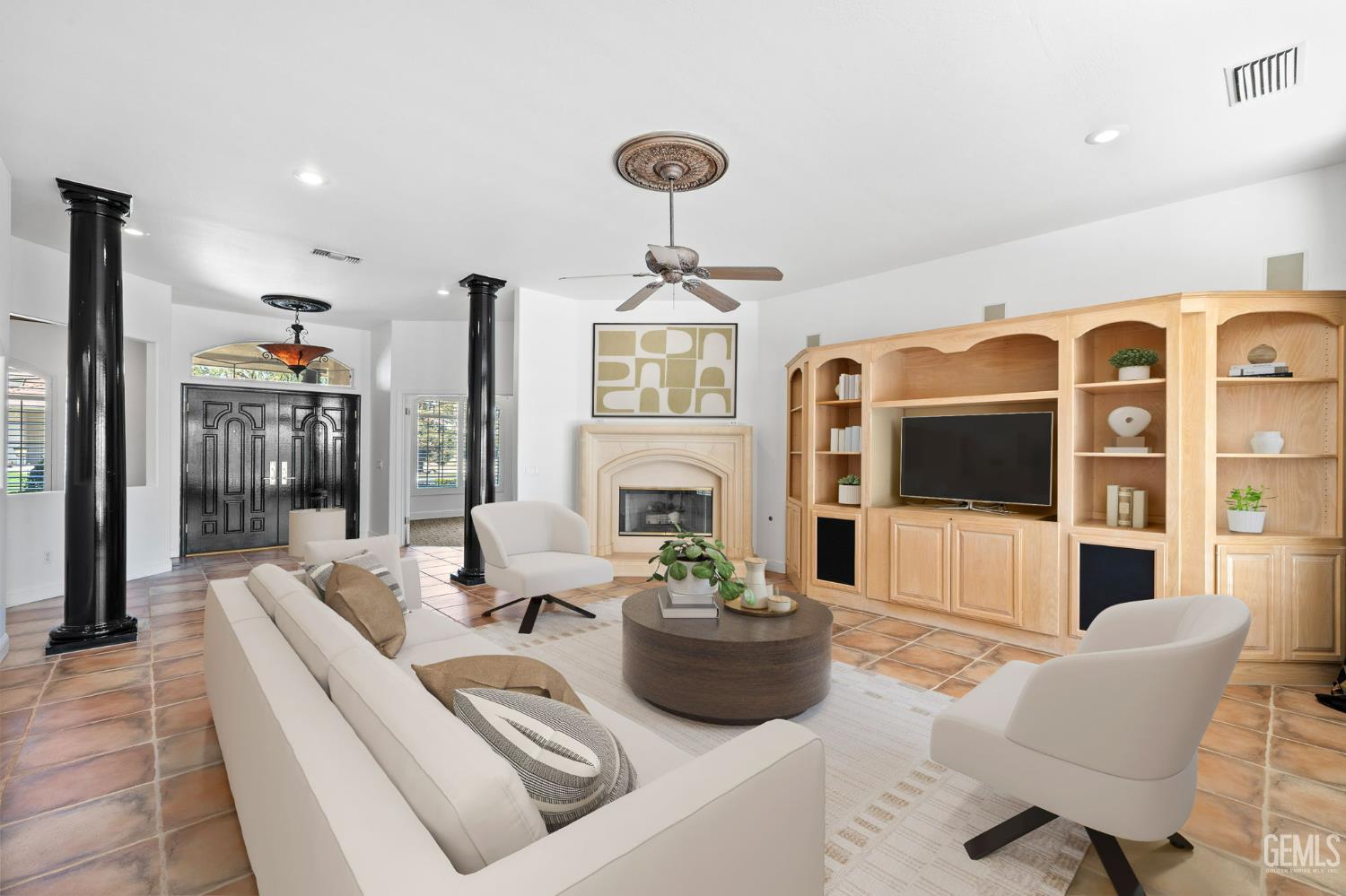 Undisclosed Address Bakersfield, CA 93308 - Photo 6 of 30 a living room with furniture a flat screen tv and a large window