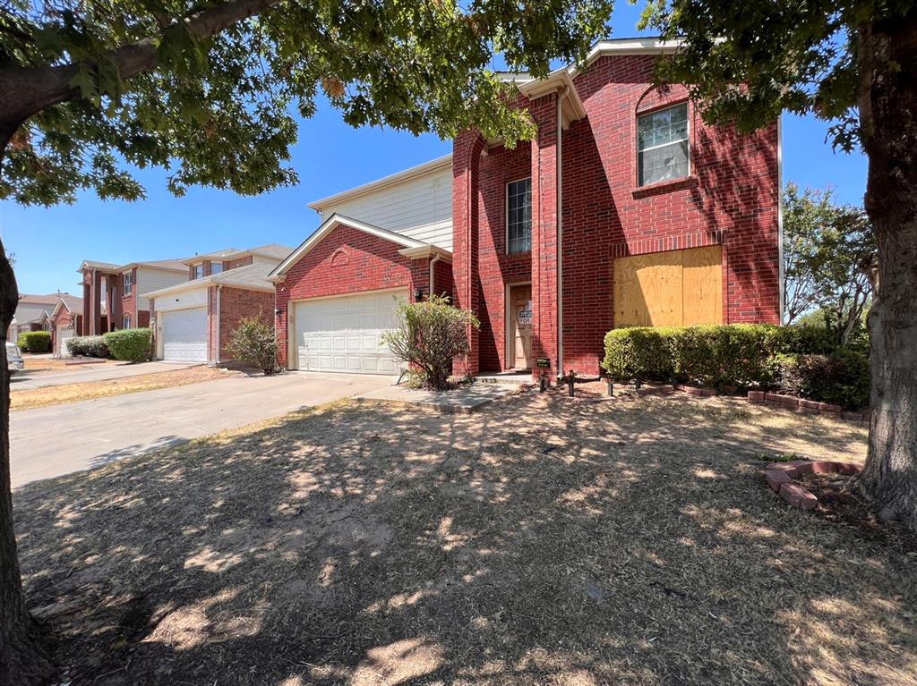 2904 Vicksburg Lane Fort Worth, TX 76123 - Photo 1 of 1 a front view of a house with a yard