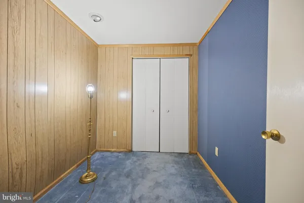 a view of an empty room with a fireplace