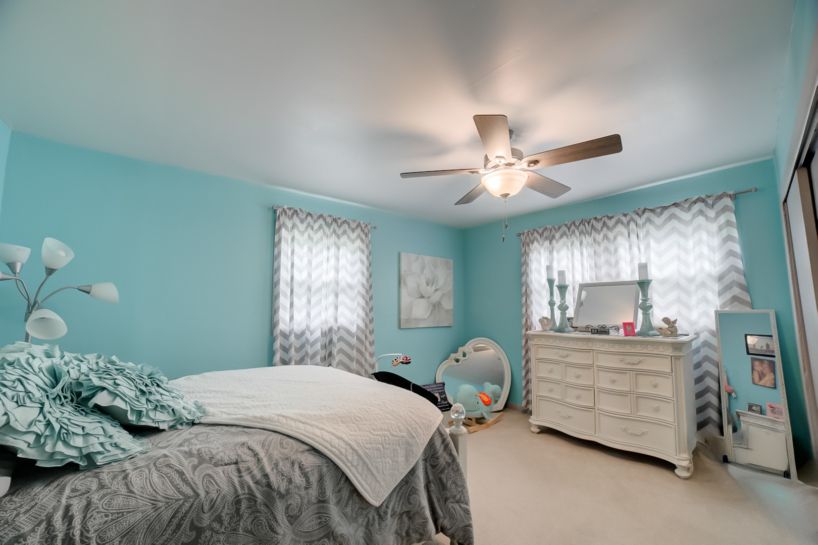 205 North Park Street Milford, IL 60953 - Photo 11 of 23 a bedroom with a bed and a chandelier