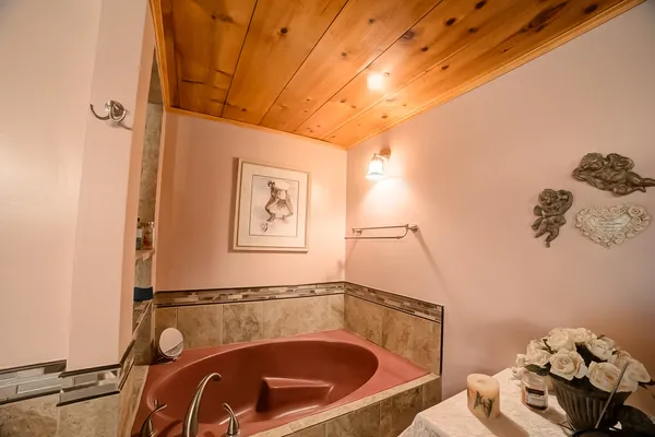 a bathroom with a sink mirror vanity and toilet