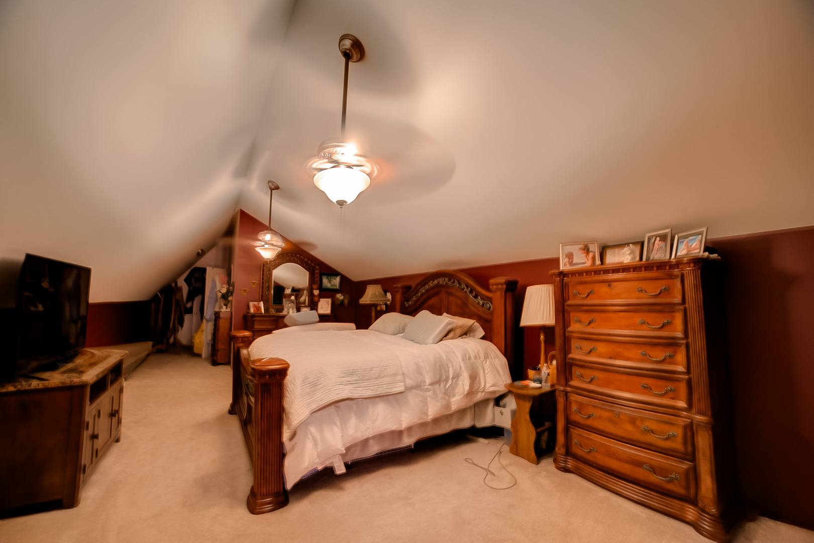 205 North Park Street Milford, IL 60953 - Photo 16 of 23 a bedroom with bed and a chandelier