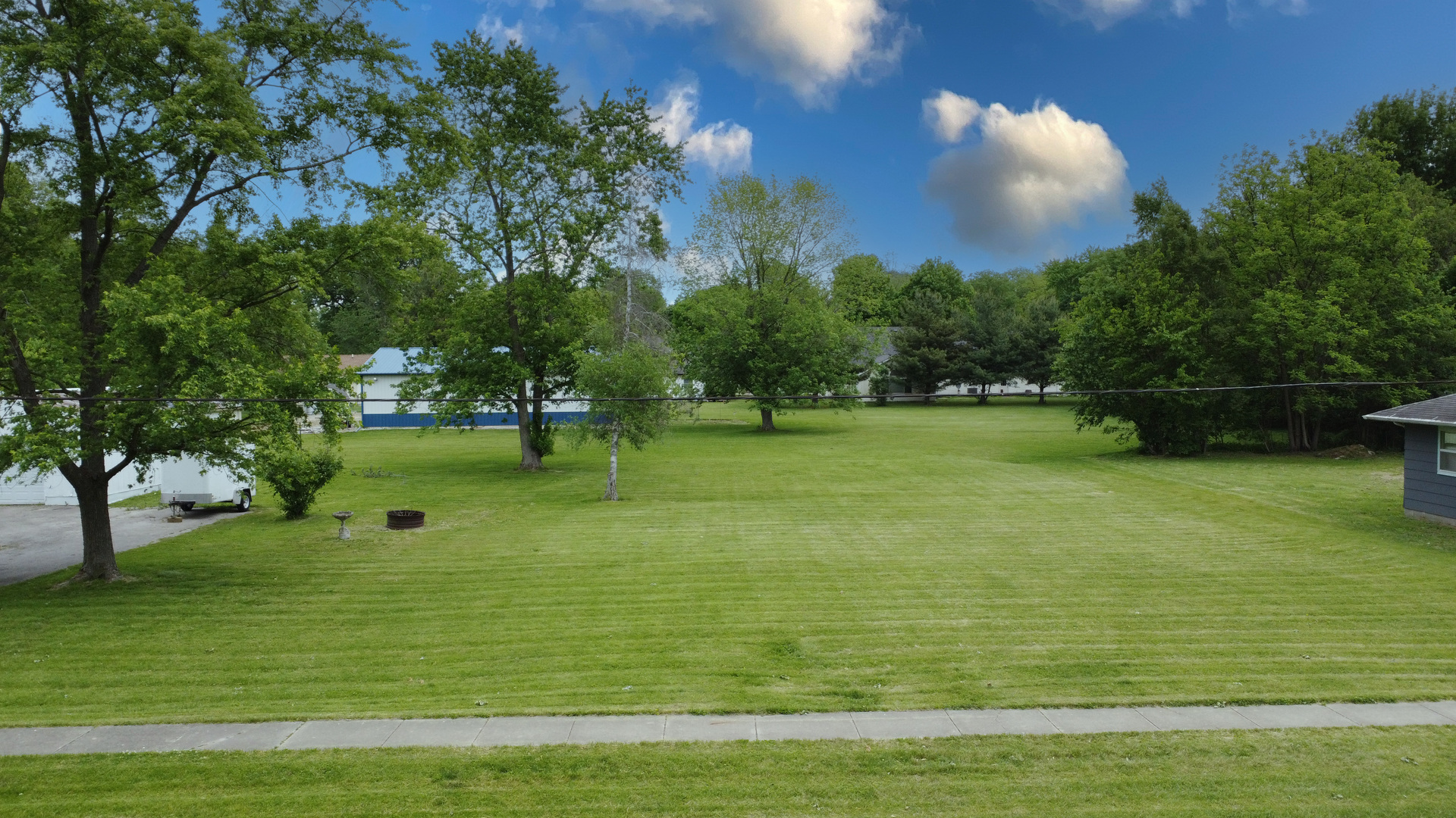 205 North Park Street Milford, IL 60953 - Photo 19 of 23 a view of a golf course with a lake